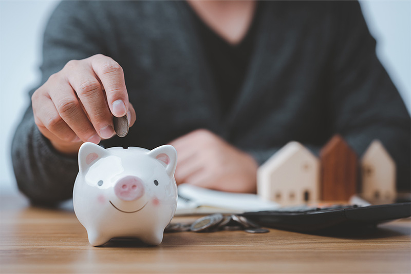 An employee putting money into savings.