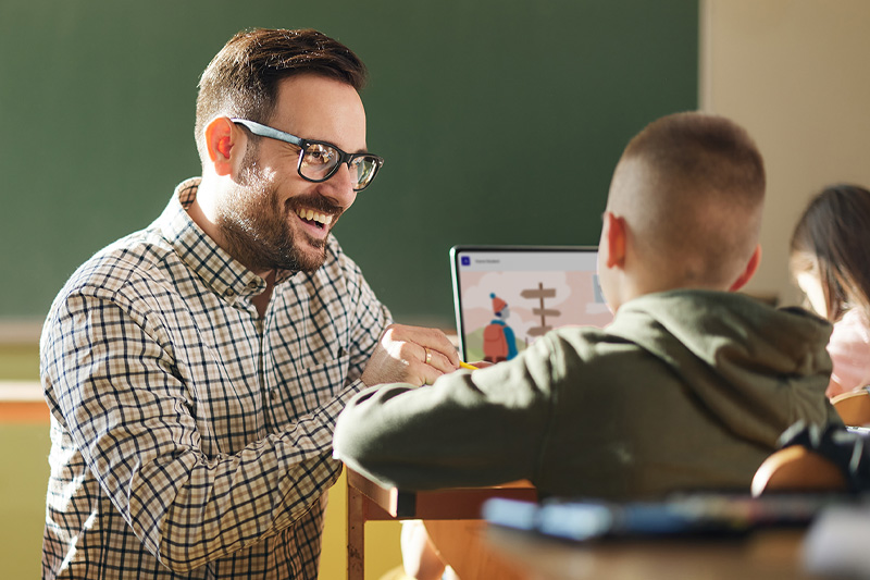 Smiling educator connecting with a student.