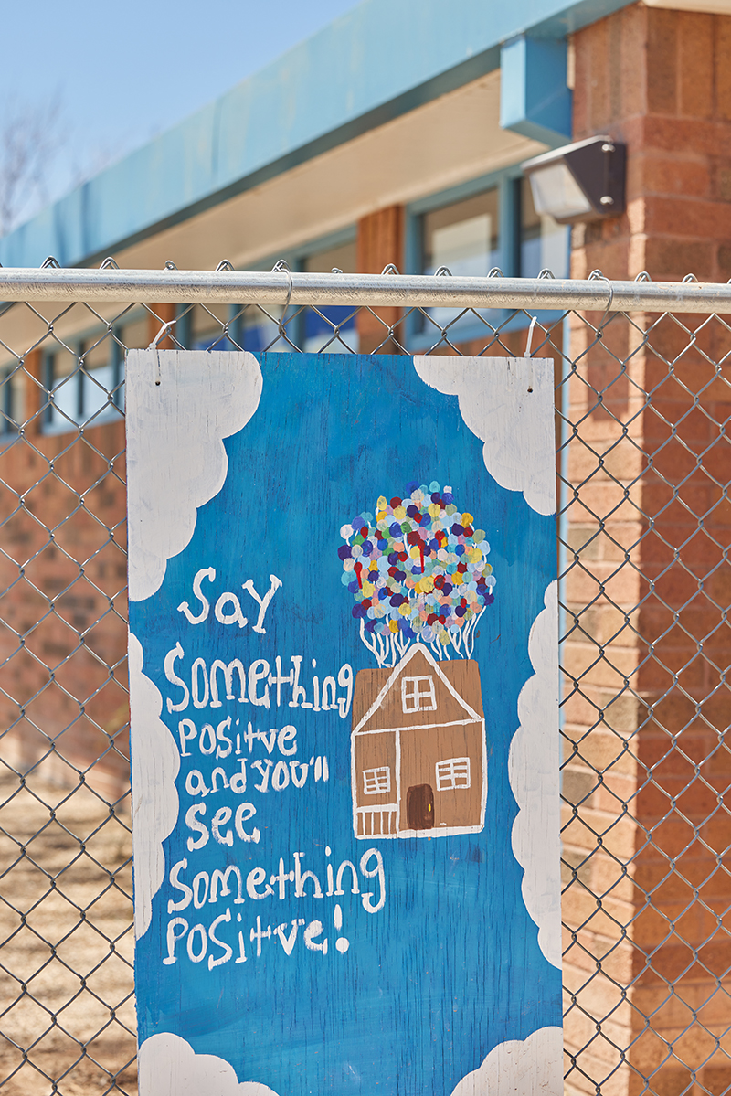 Colorful sign out front of school.